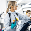 employee in manufacturing environment with bespoke uniform