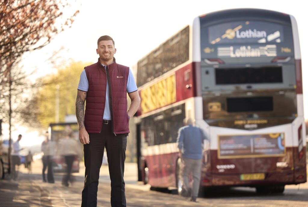Lothian Buses - Driver In Gilet Beside Bus