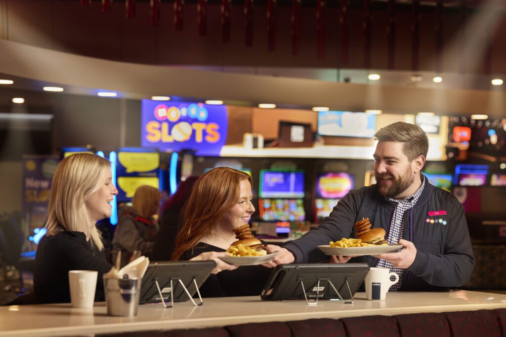 Mecca Bingo - Host Serving Food To Guests