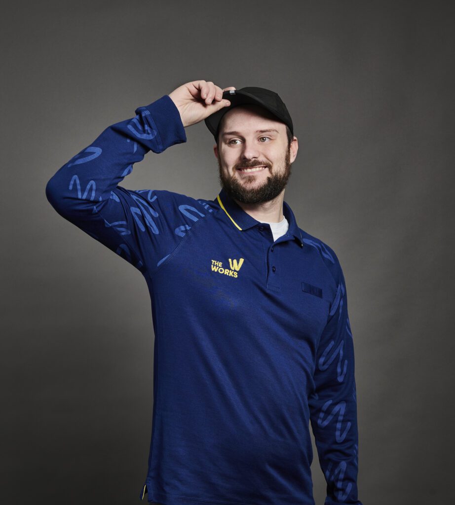 The Works - Male Colleague In Navy Polo And Cap