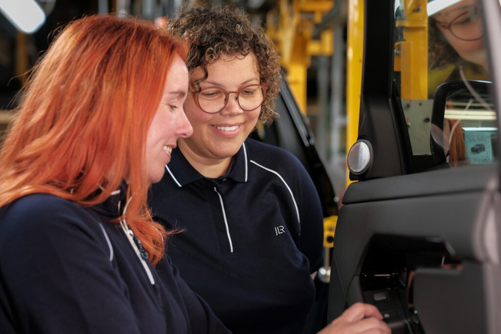 Warehouse - Two Colleagues At Forklift Terminal